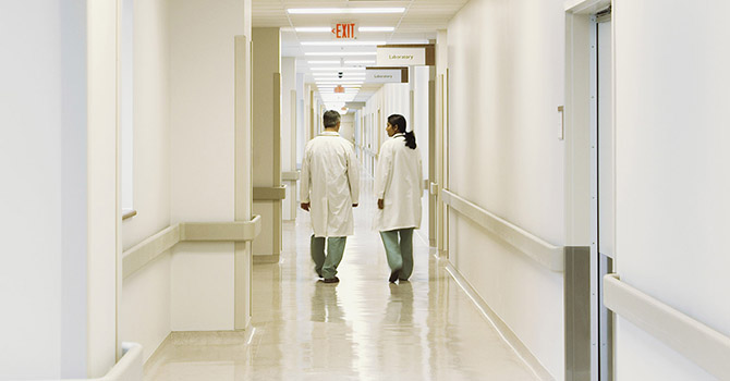 Doctors talking in a hospital hallway