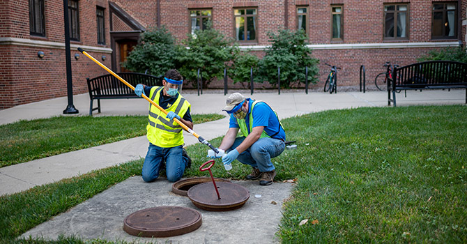 Sampling wastewater on the University of Michigan campus.
