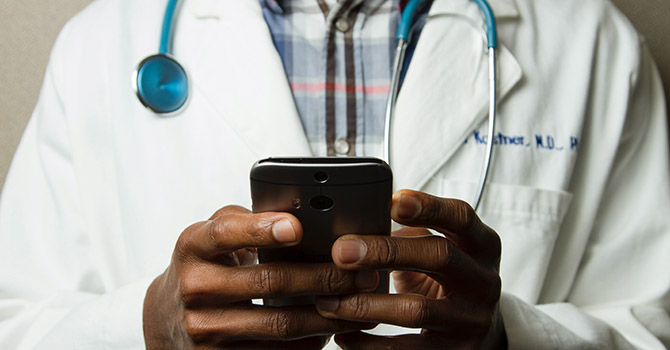 Doctor holding a smartphone