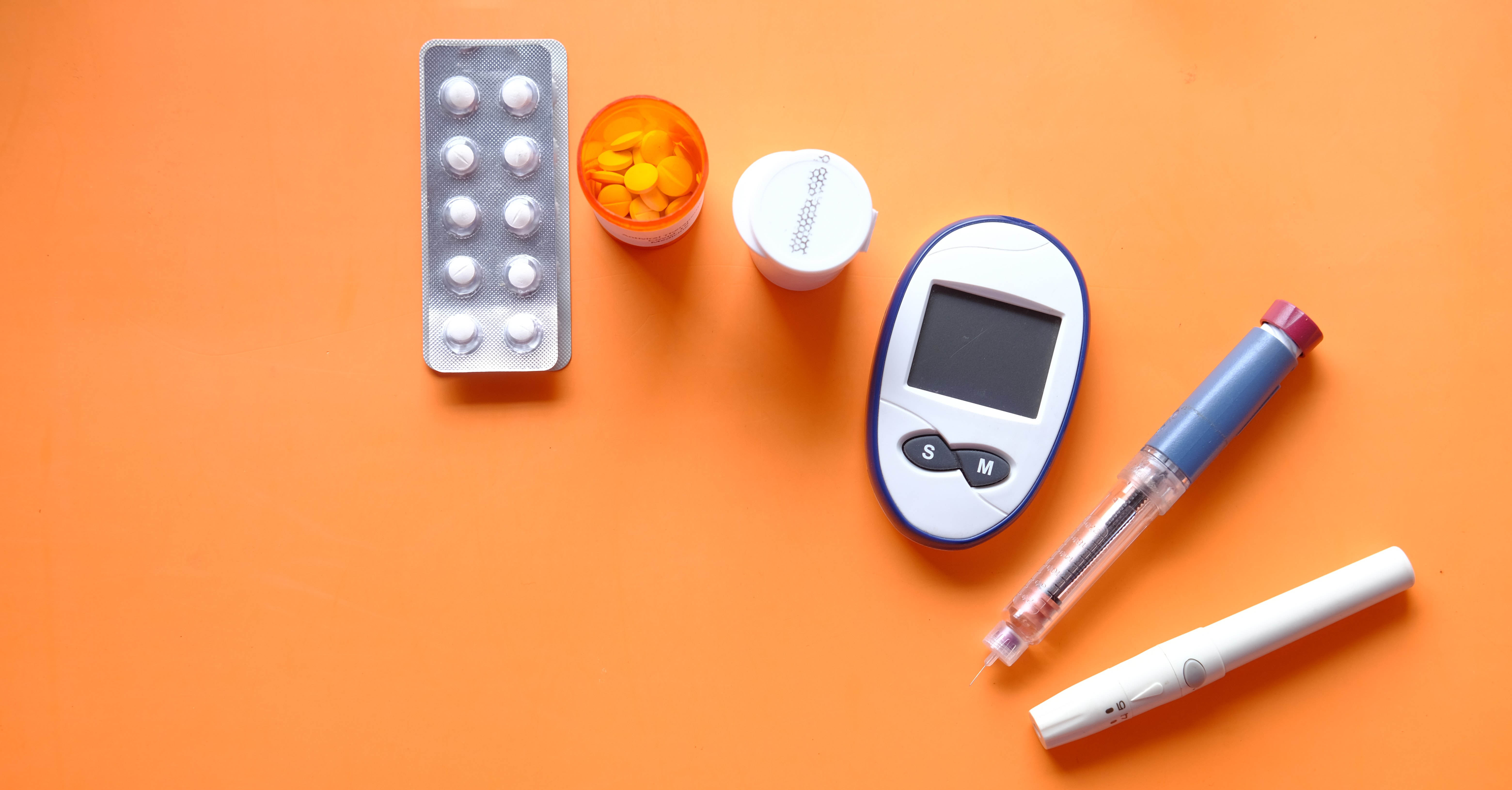 Diabetes medication on an orange background.