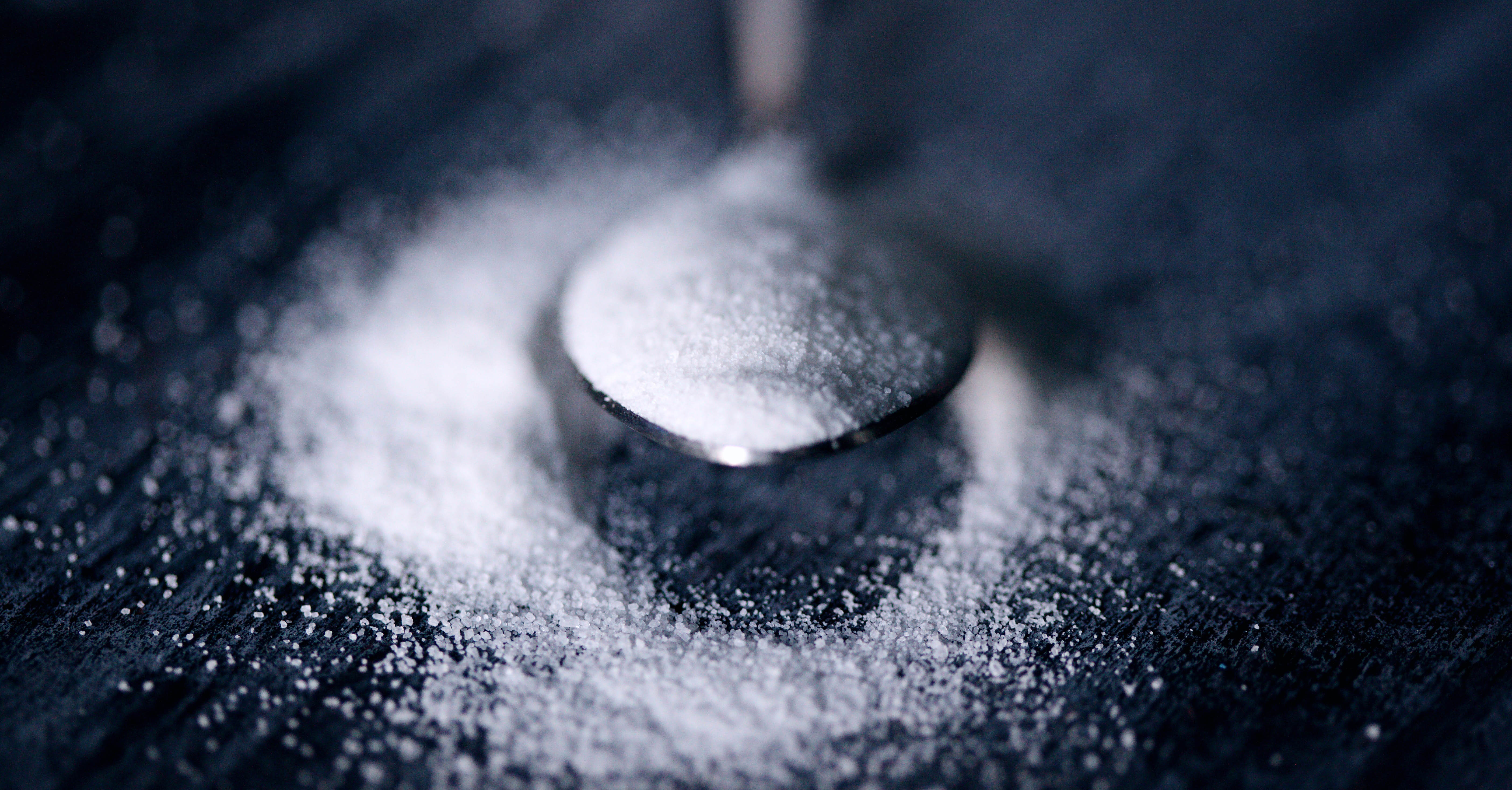 Sugar substitute aspartame on a spoon.