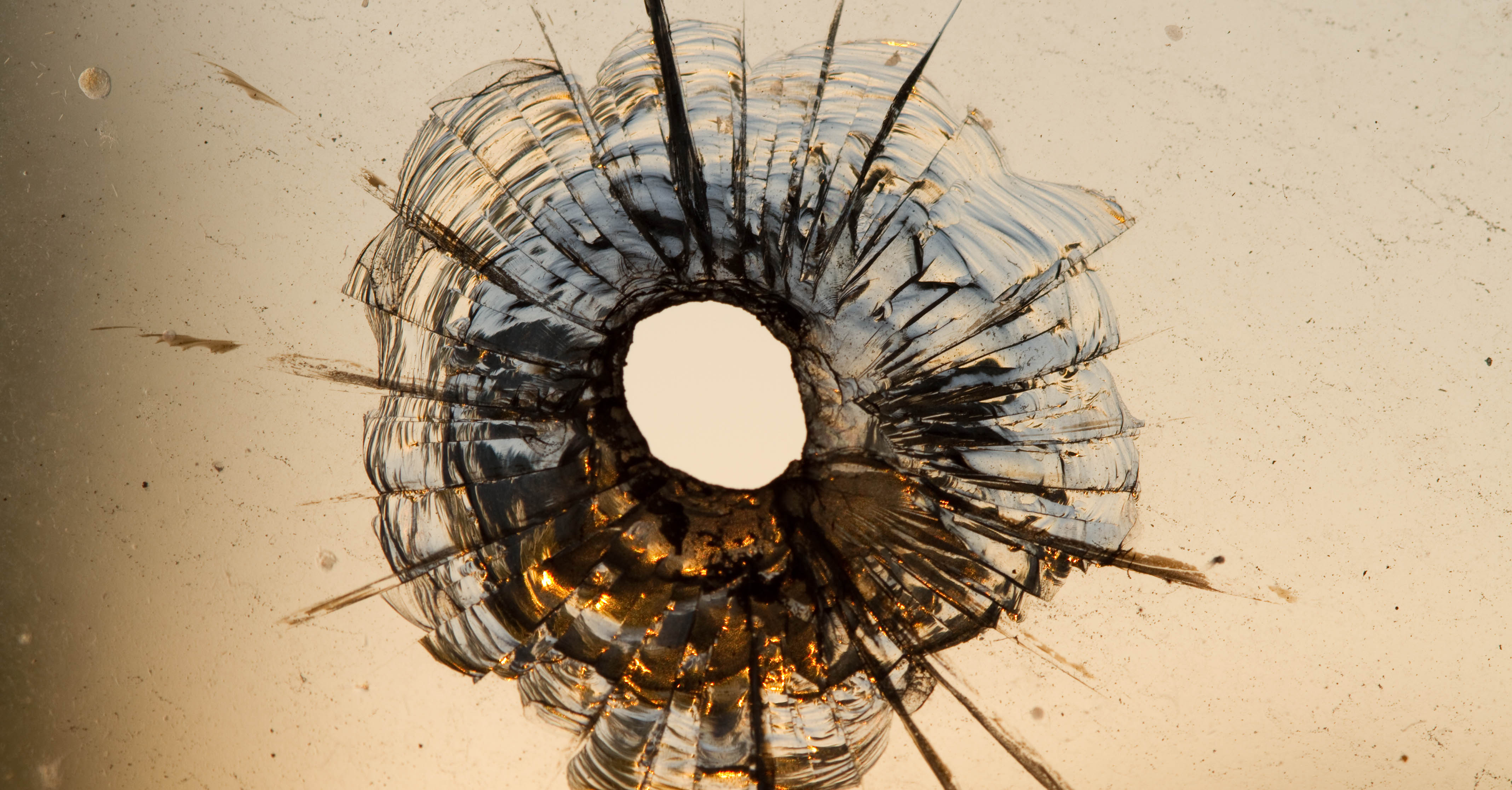Glass with a bullet hole.